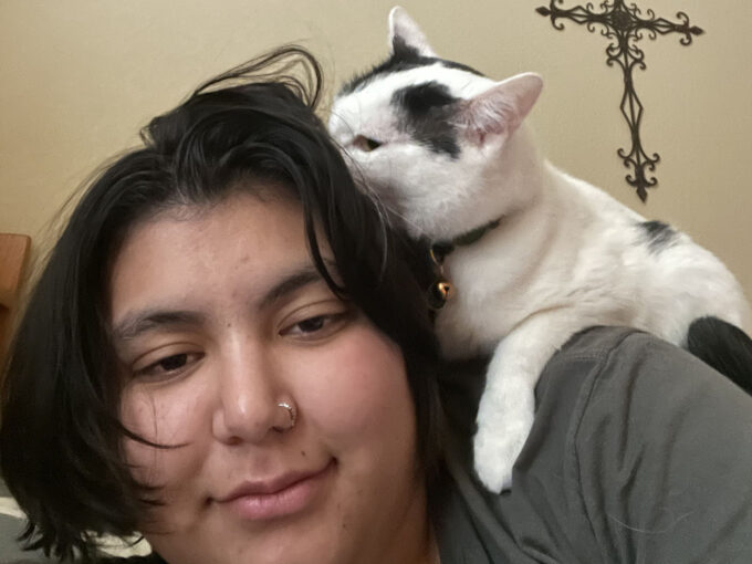 cat on person's shoulder